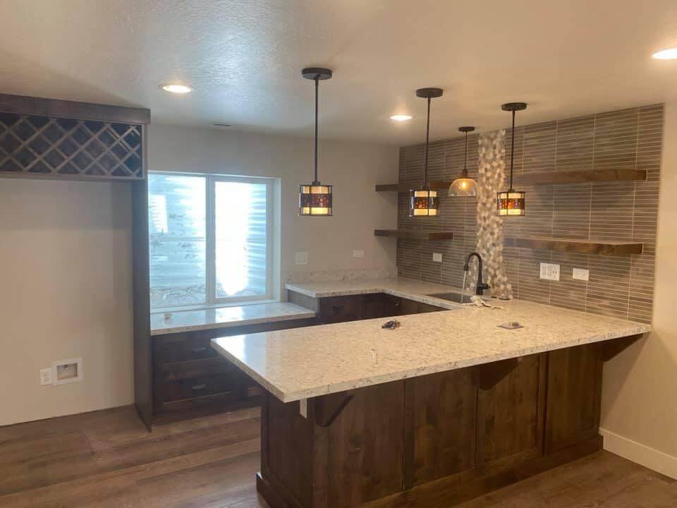 An image of a kitchen in Utah Basement Refinishing Kitchen, featuring a countertop and cabinets.