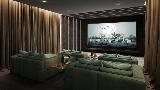 A stylish home theater with plush green couches and a big screen perfect for movie nights