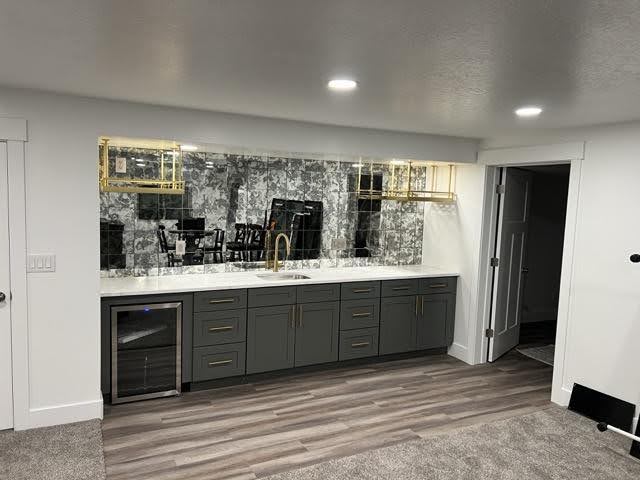 A modern kitchen with a sink and countertop highlighting a functional area for meal preparation